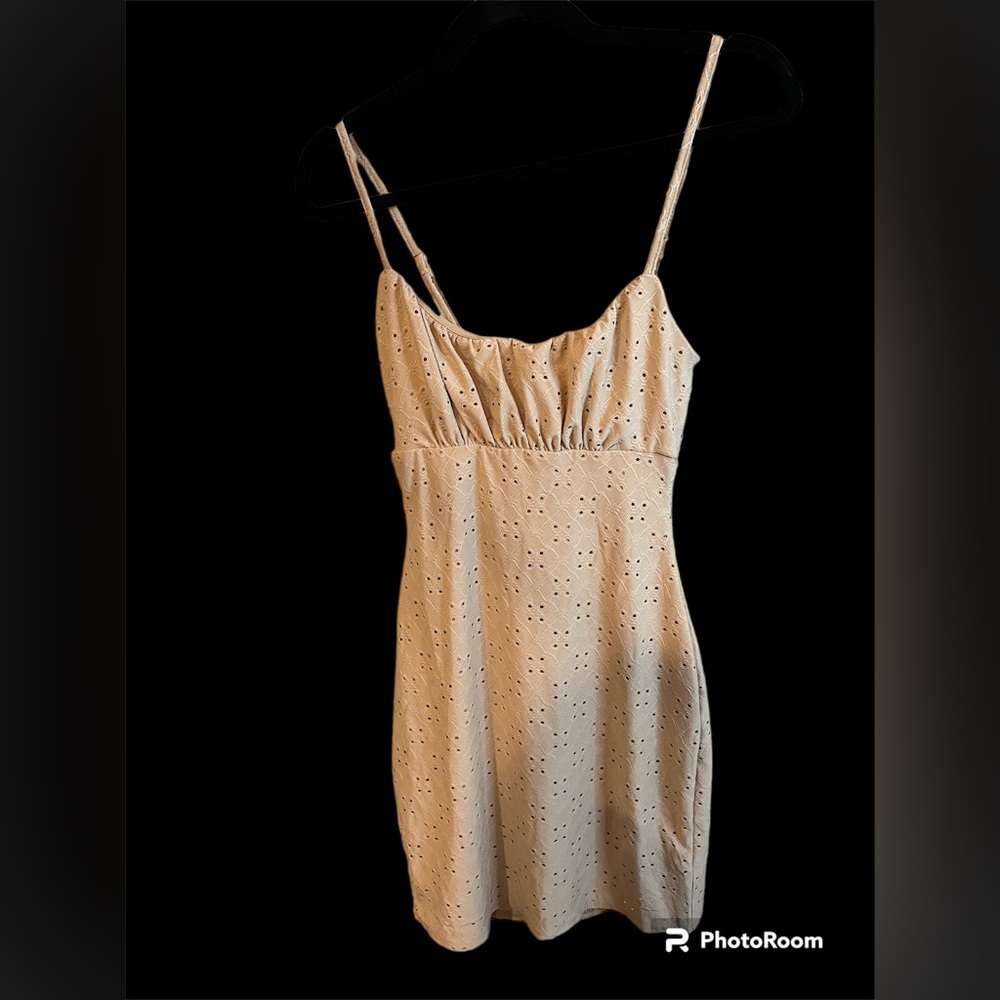 Beige fitted dress.